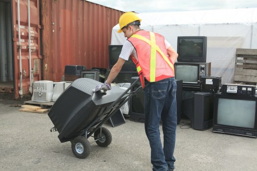 Technician ensuring safety during loft clearance procedure